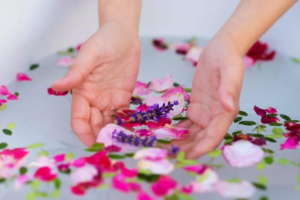 Beautiful young woman taking a herbal bath.